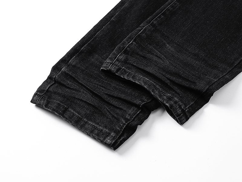AMIRI Black Distressed Ribbed Knee Jeans — detail